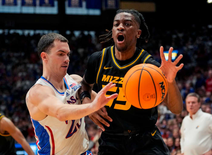 Dec 9, 2023; Lawrence, Kansas, USA; Kansas Jayhawks guard Nicolas Timberlake (25) knocks the ball away from Missouri Tigers guard Sean East II (55) during the first half at Allen Fieldhouse.